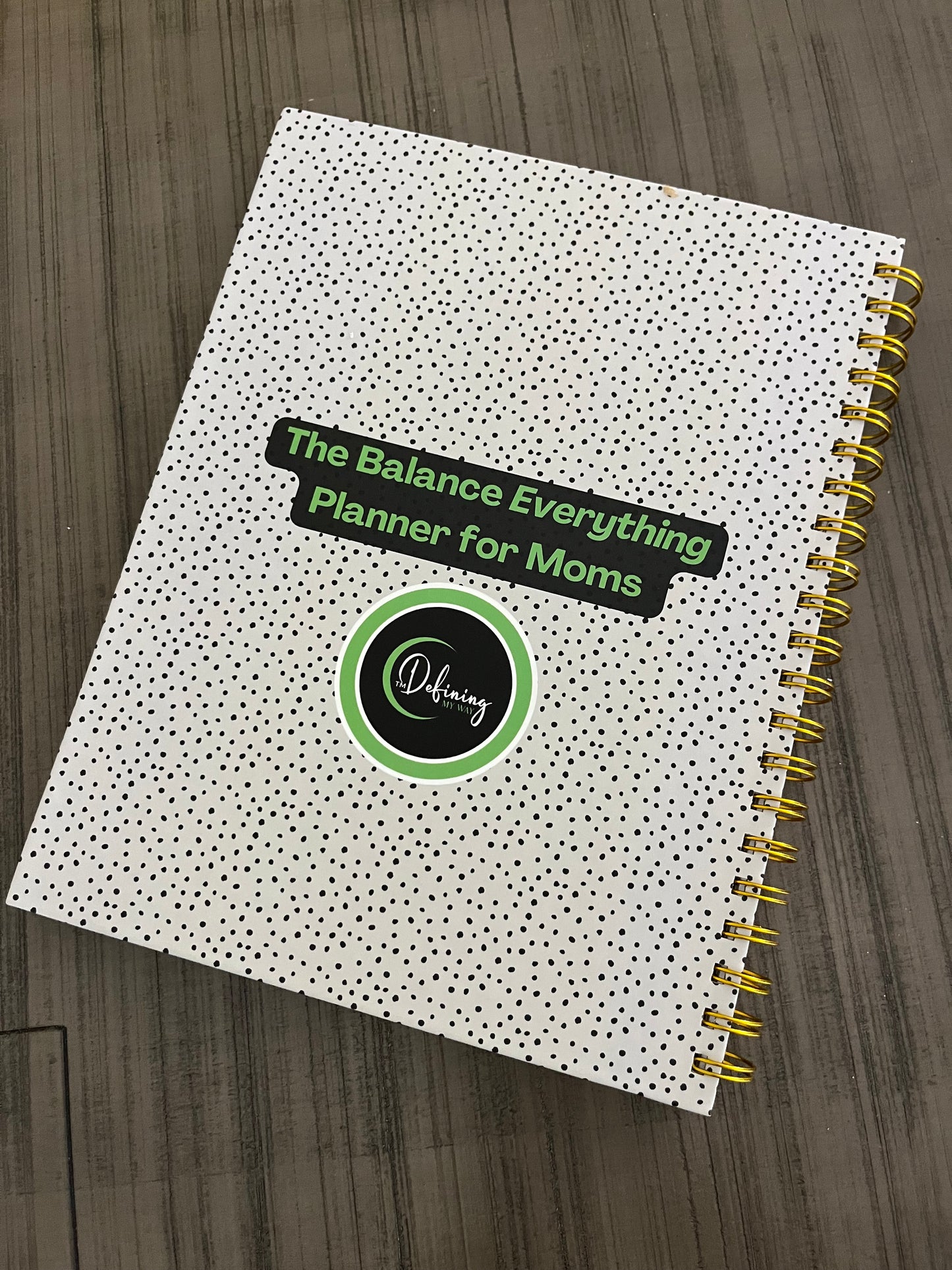Hustle & Flow Planner back cover mockup featuring bold, feminine branding designed for busy moms and creators.