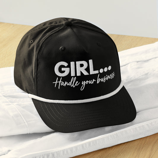 A Black embroidered black rope hat with GIRL... Handle Your Business script lettering